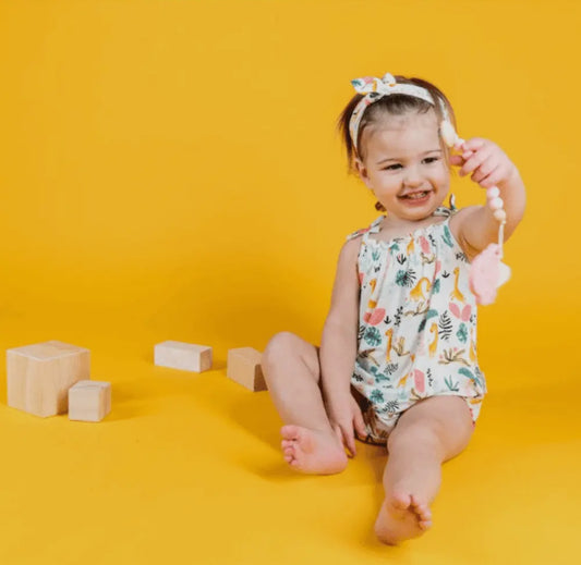 The Petite Giraffe Bubble romper with tie